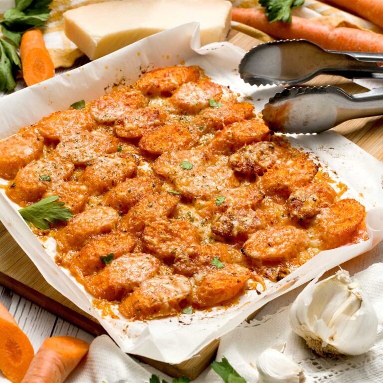 Garlic Parmesan carrots on an air fryer tray.