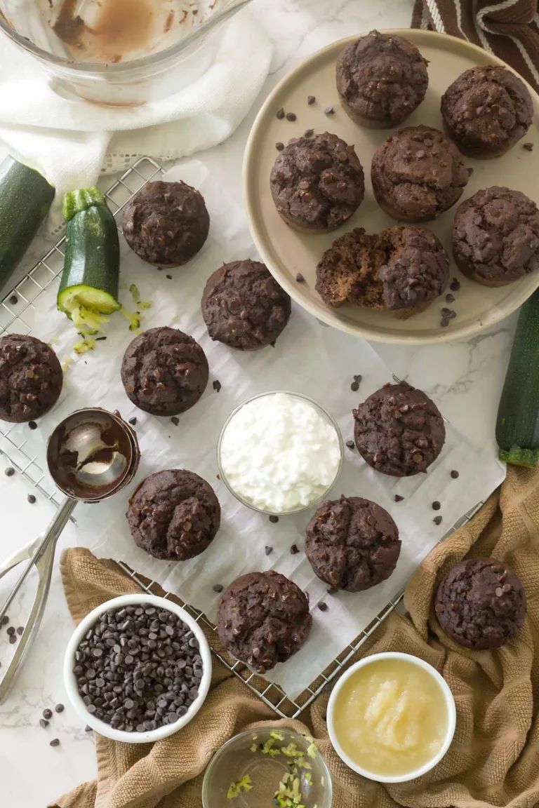 Looking down on gluten-free double chocolate zucchini banana muffins on a cooling rack.
