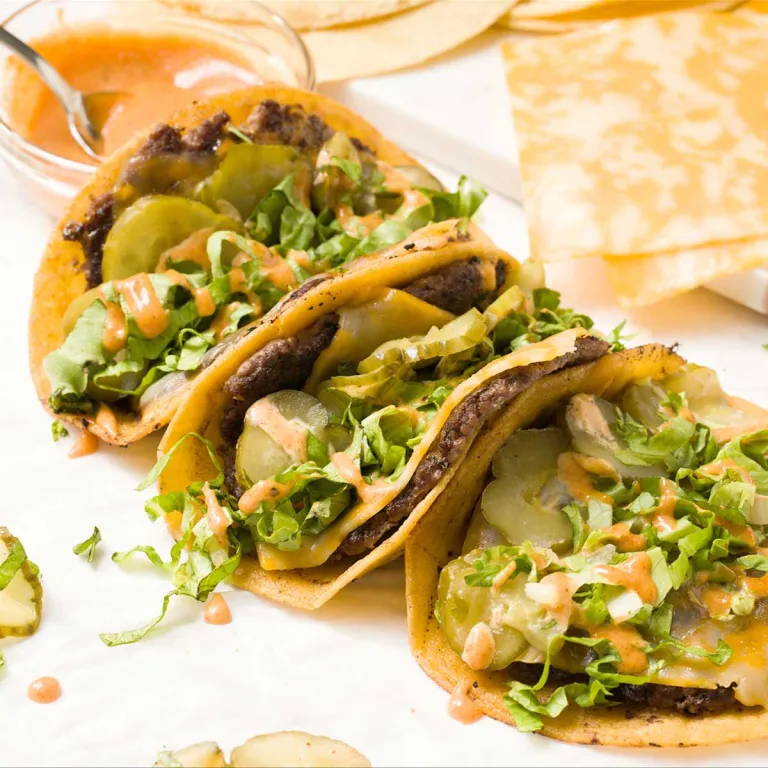 The easiest recipe for healthy & juicy gluten-free Big Mac tacos w/ smash burgers, cheese, corn tortillas, pickles, lettuce, & Big Mac sauce