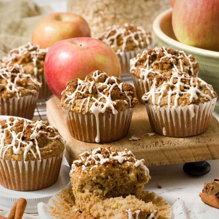 Crave-worthy gluten free apple muffins w/ white chocolate maple glaze, apples, applesauce, apple cider, oat & almond flour, maple & cinnamon