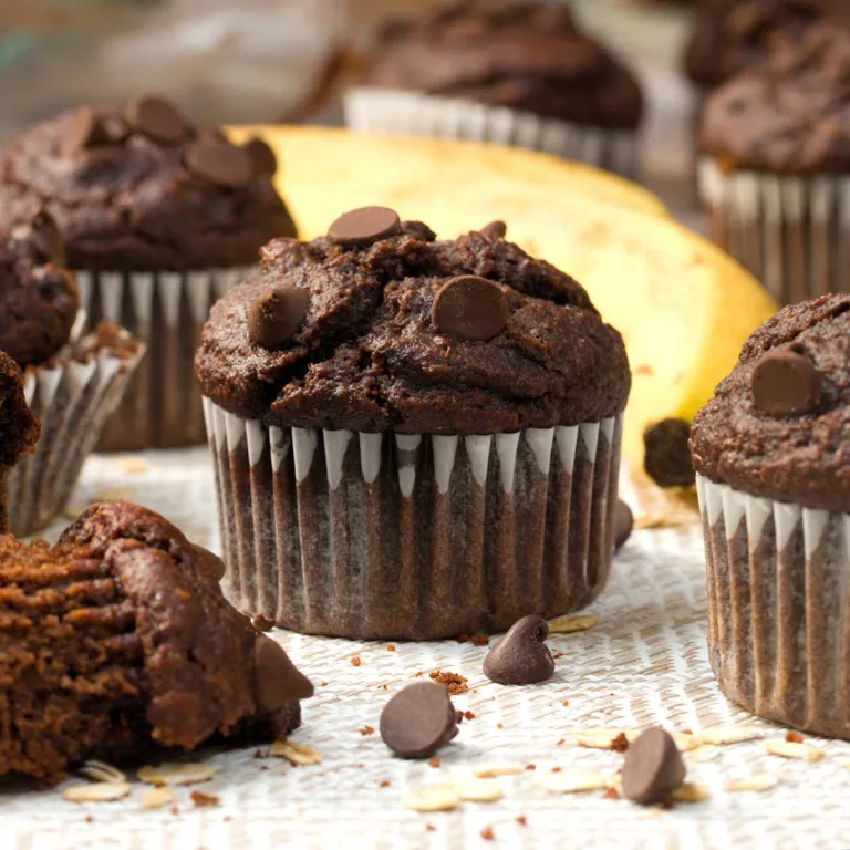 Gluten-Free Double Chocolate Chip Cottage Cheese Banana Muffins with a high dome top.
