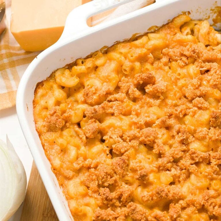 Close-up of cottage cheese mac & cheese with butternut squash in a casserole dish.