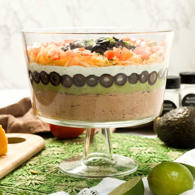 Gluten-Free Layered Bean Dip with Cottage Cheese in a trifle bowl.
