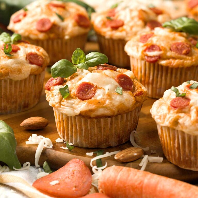 Gluten-Free pizza muffins on a cutting board.