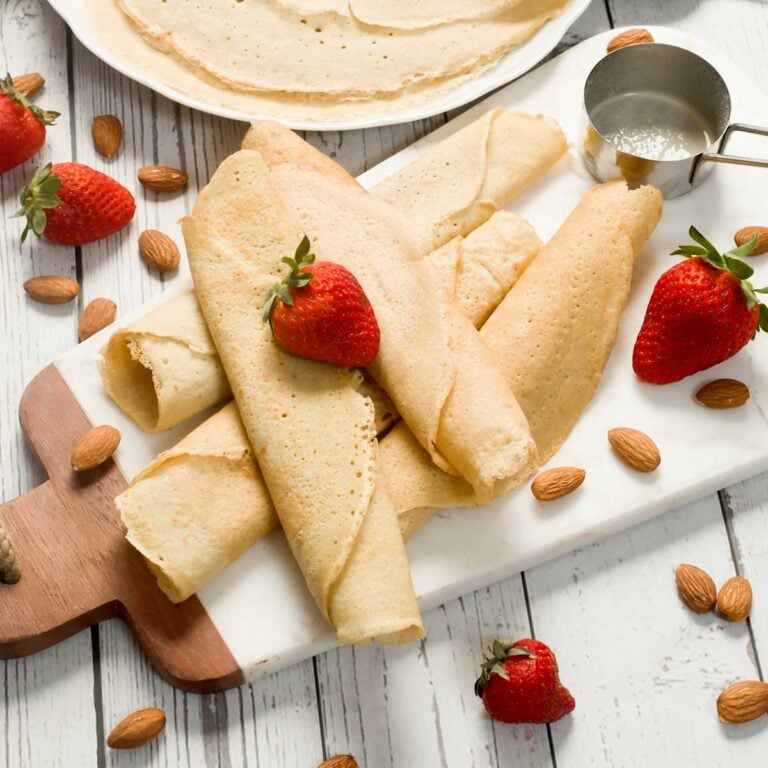 Stack of almond flour crepes on a plate.