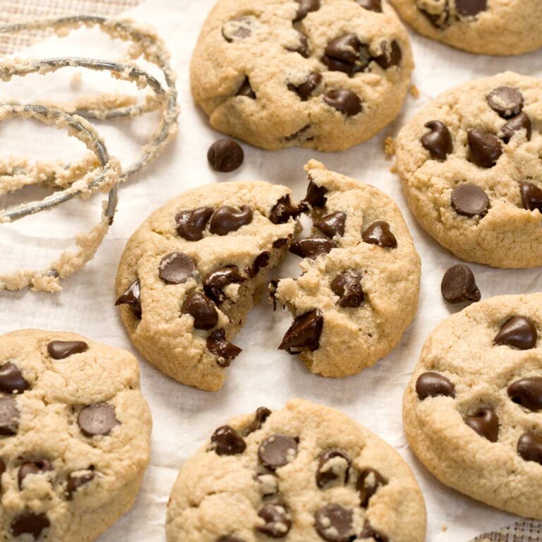 Chocolate chip cassava flour cookies on a parchment paper.