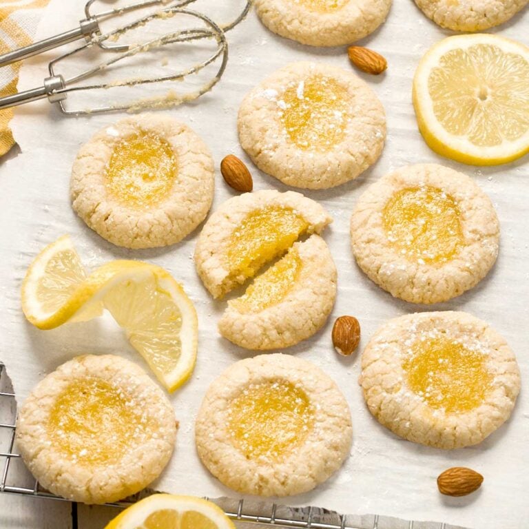 Lemon curd cookies on a piece of white parchment paper.