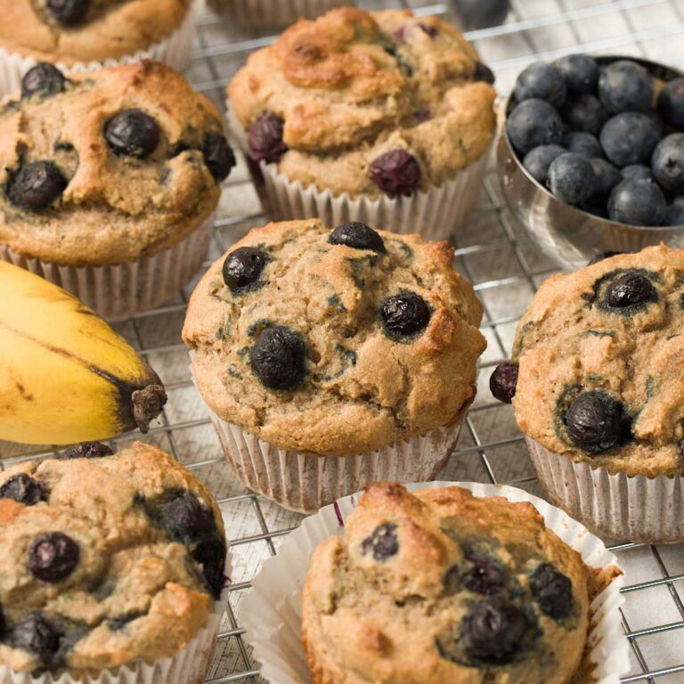 Blueberry banana muffins on a cooling rack.
