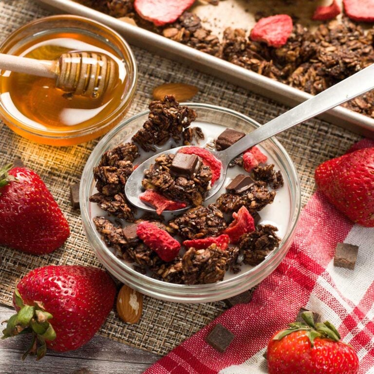 Bowl of copycat Love Crunch strawberry chocolate granola.
