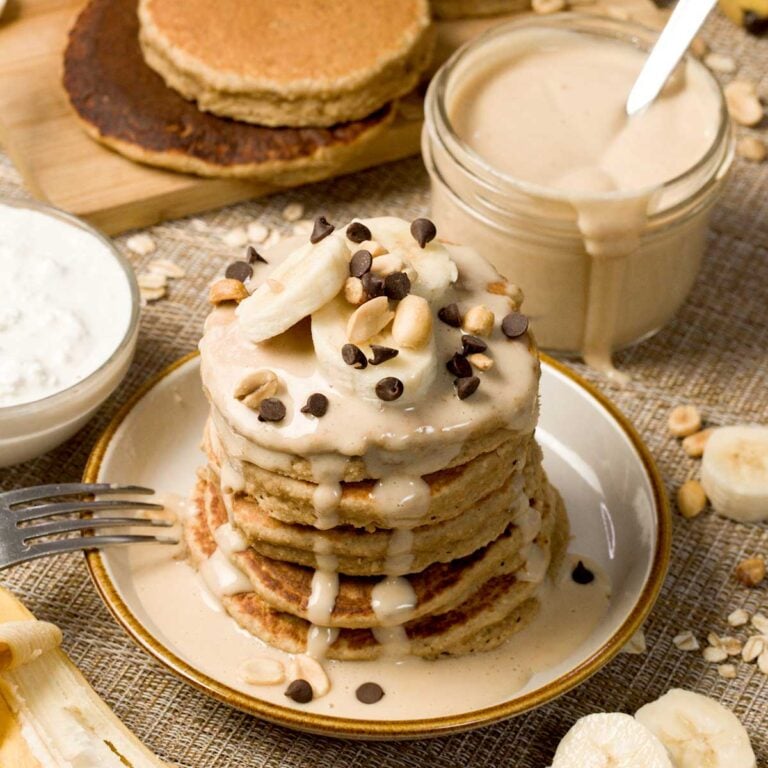 Stack of peanut butter banana pancakes on a plate.