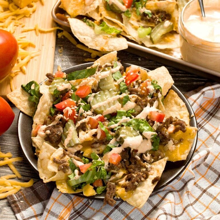 Plate of big mac nachos with big mac sauce.