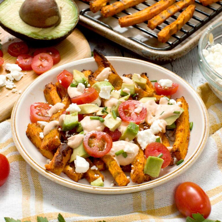 Loaded sweet potato fries on a plate.
