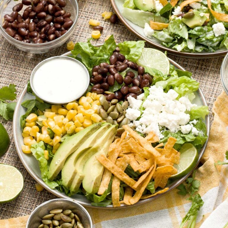 Mexican Caesar Salad recipe with Caesar dressing on a plate.