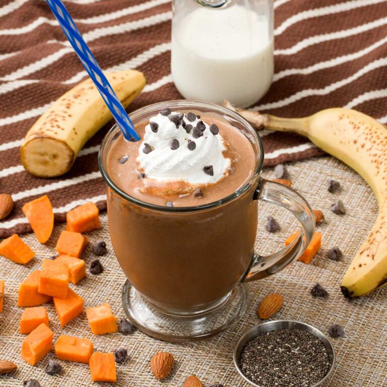 Chocolate sweet potato smoothie with whipped cream on top.