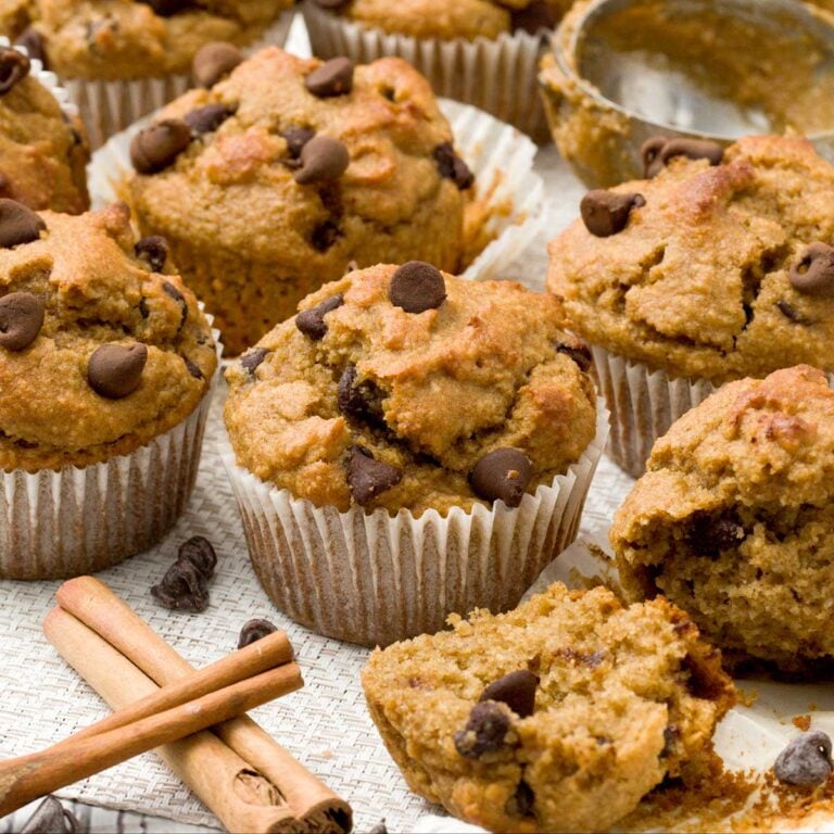 Pumpkin Banana Bread Muffins on kitchen counter with chocolate chips.