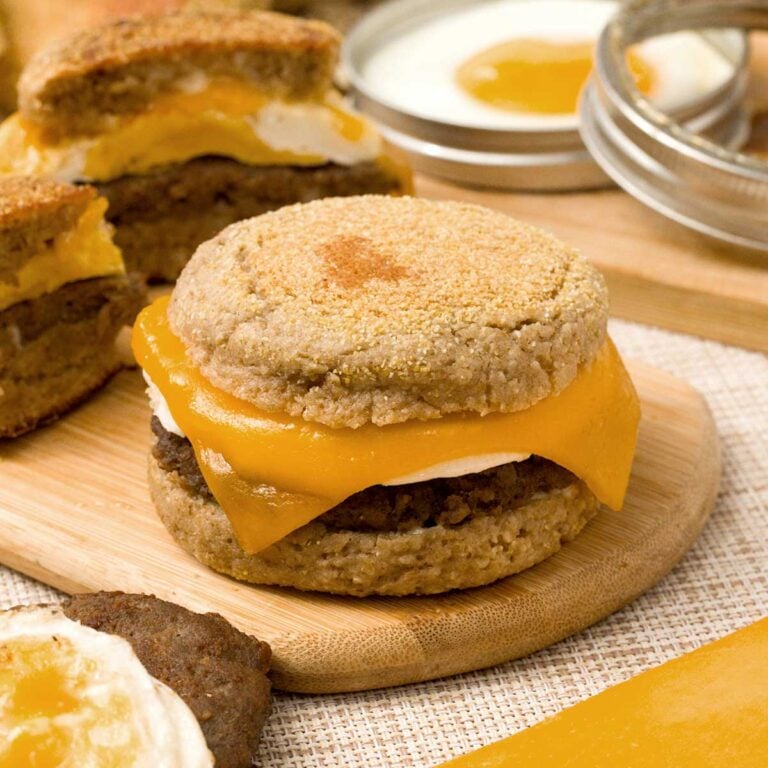 Breakfast sandwich with egg, cheese, and sausage with a gluten-free English muffin.