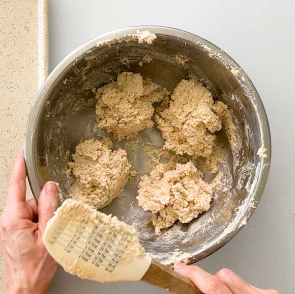 Dividing the dough into four muffins.