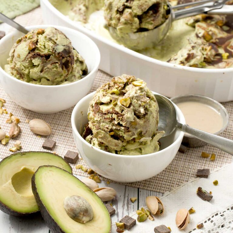 Bowls with Dubai chocolate bar inspired pistachio chocolate cottage cheese ice cream.
