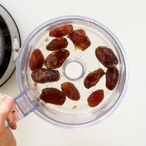 Soaking the dates in hot tap water for 10 minutes.