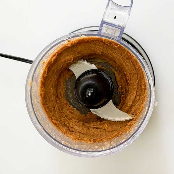 The mixed date caramel in a food processor.