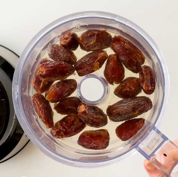 Soaking the dates in hot tap water for 10 minutes.