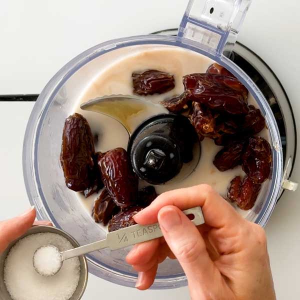 Adding all the ingredients to a food processor.