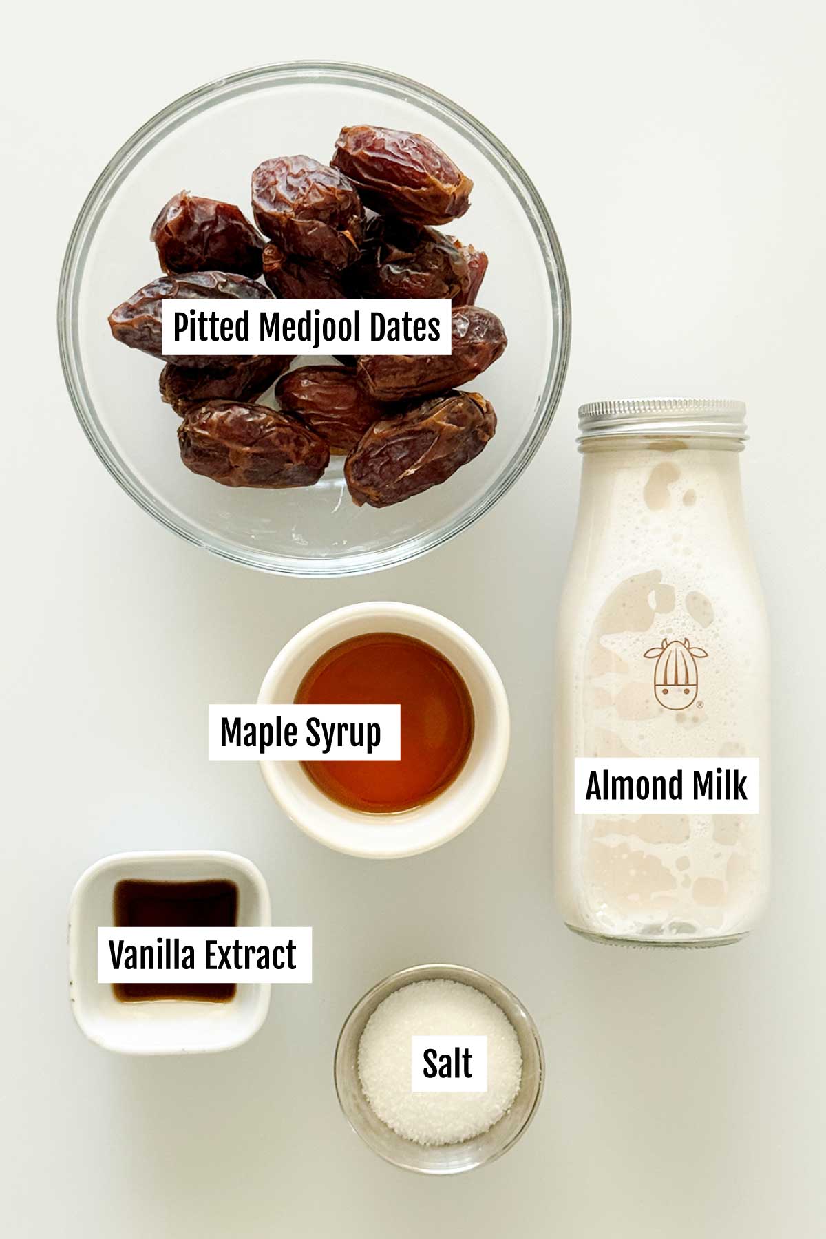 All the ingredients you need to make dairy free caramel sauce with almond milk and maple syrup.
