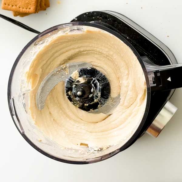 The cottage cheese ice cream ingredients blended smooth and a food processor.