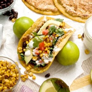 Chicken smashed tacos with Mexican street corn and cilantro lime creamer.