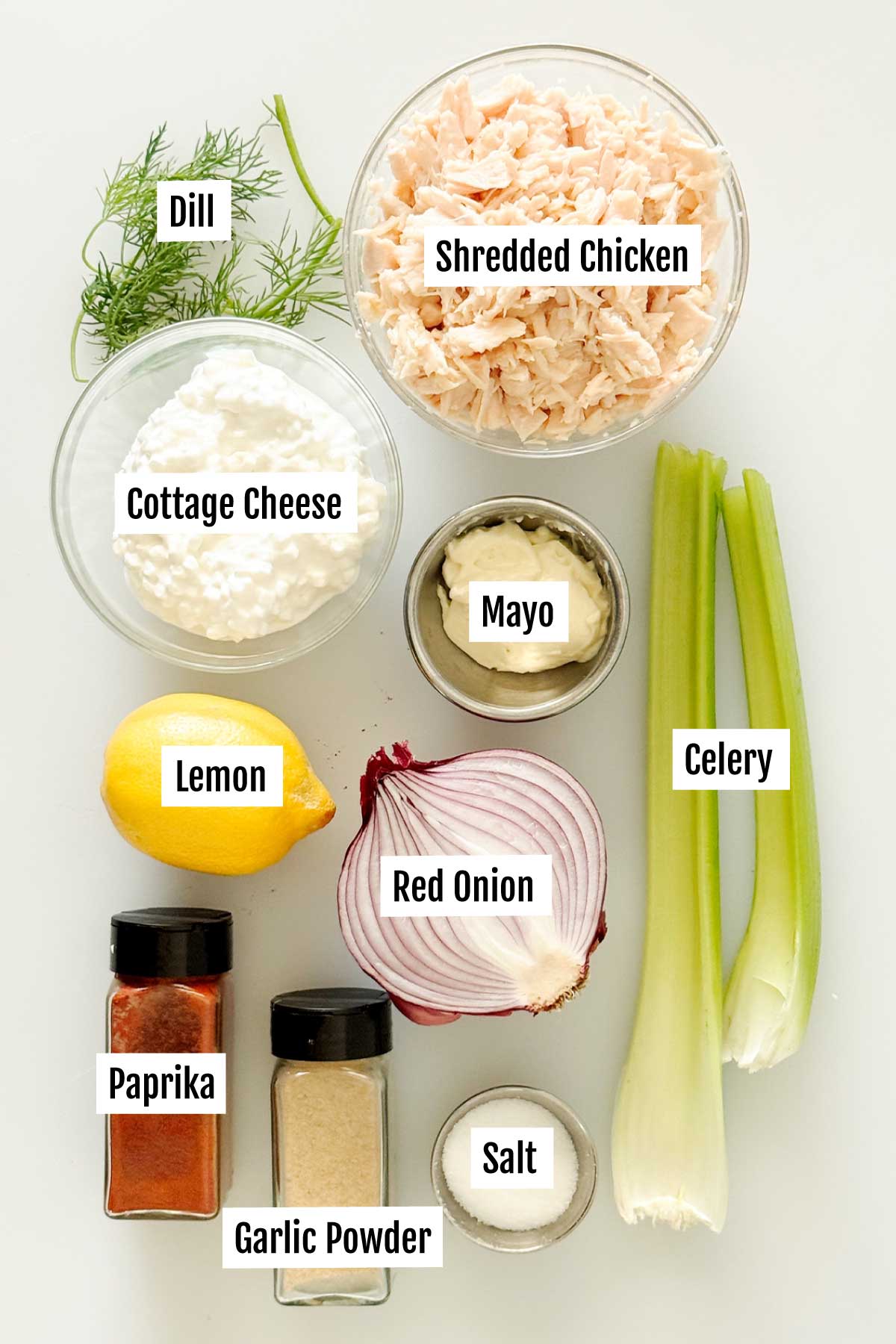All the ingredients you need to make high protein chicken salad with cottage cheese and celery.