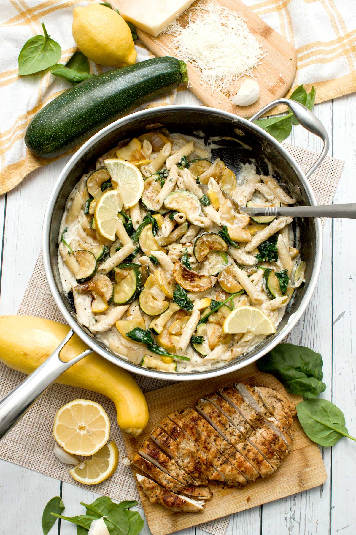 A skillet full of high protein lemon zucchini Pasta with cottage cheese.