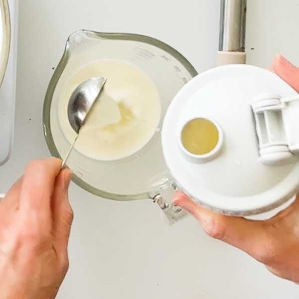 Adding the lemon juice and corn starch to a few tablespoons of held back milk.