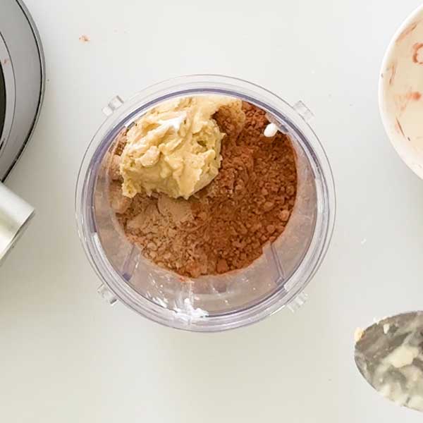 Adding the remaining ingredients to the blender cup.