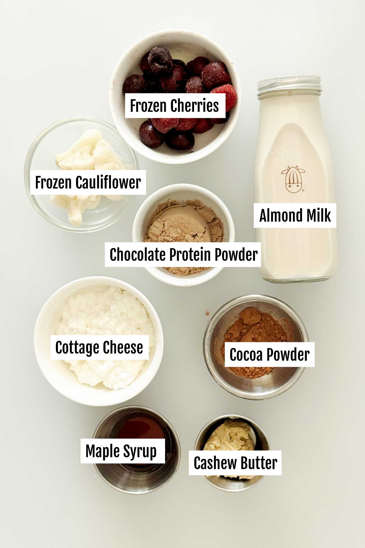 All the ingredients you need to make a protein cherry chocolate smoothie with cottage cheese.
