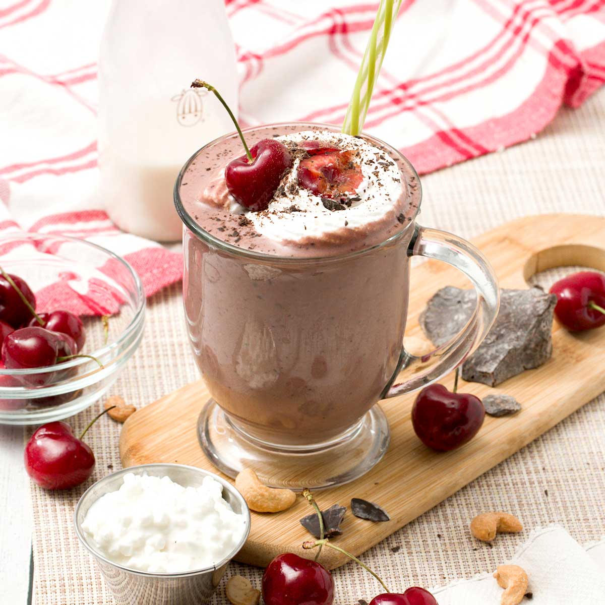 A glass of cherry chocolate smoothie with cottage cheese and frozen cauliflower.