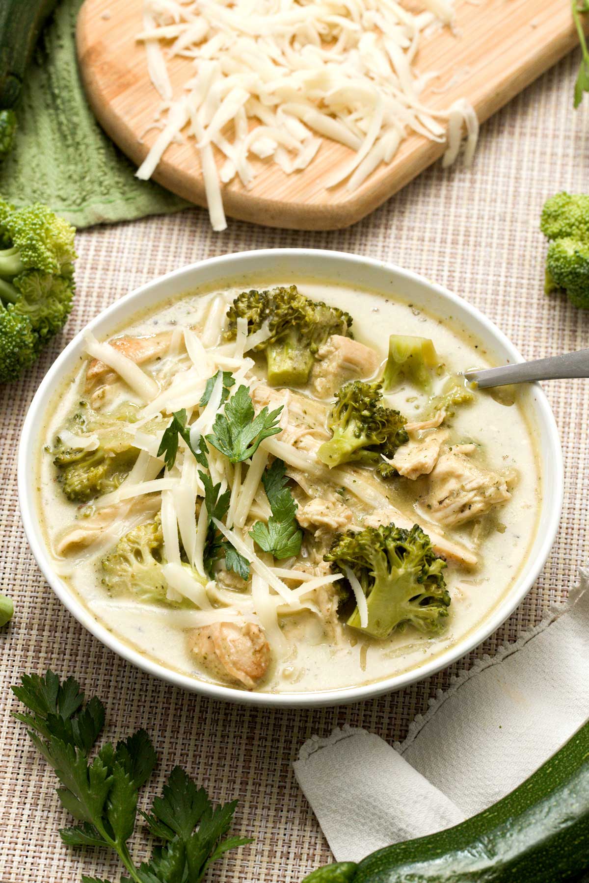 A bowl of creamy zucchini broccoli chicken soup with Greek yogurt.