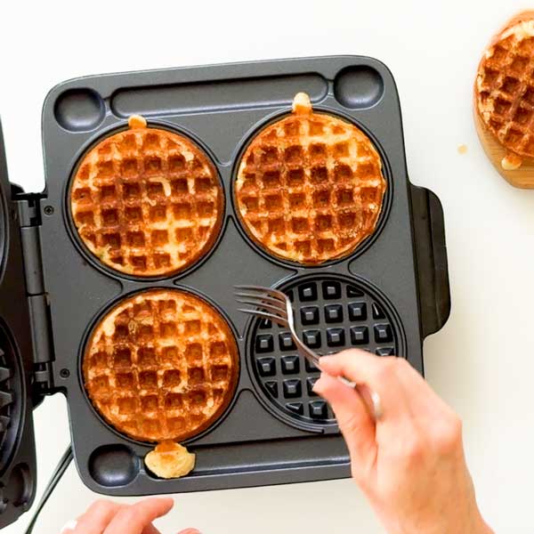 Taking the waffles out of the waffle iron.