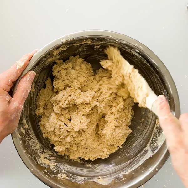 Mixing together the scone batter with a spatula.