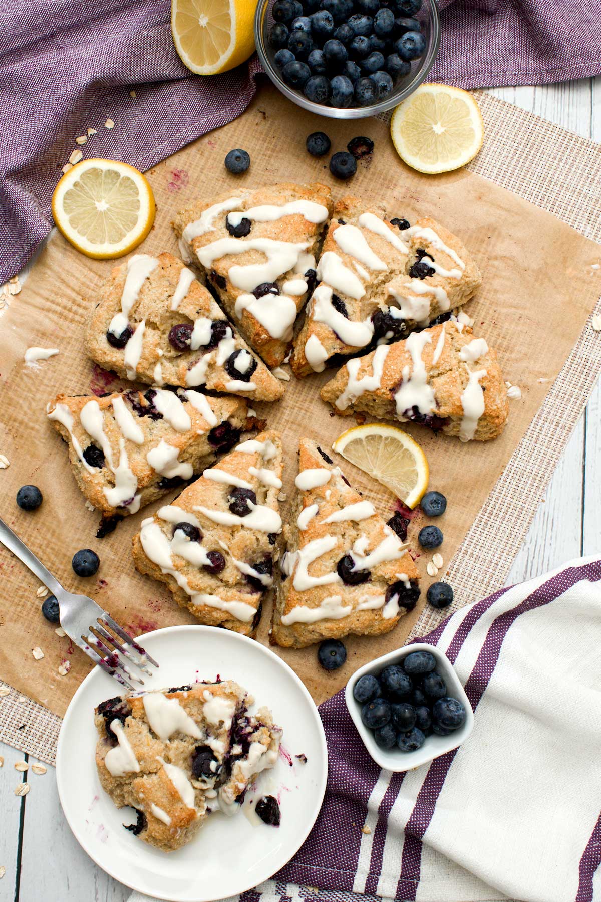 Eat gluten-free blueberry lemon scones with a maple syrup glaze on top.