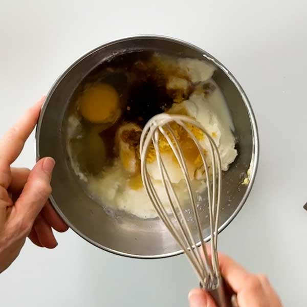 Combining all the wet ingredients in a mixing bowl.