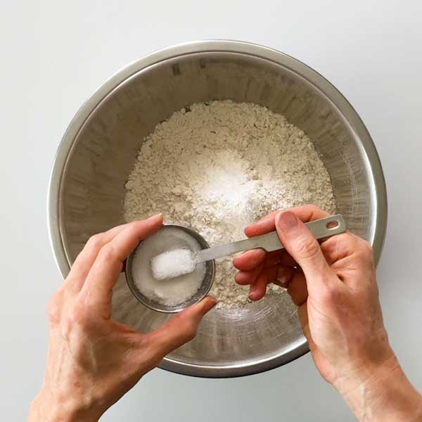 Combining all the dry ingredients in a mixing bowl.
