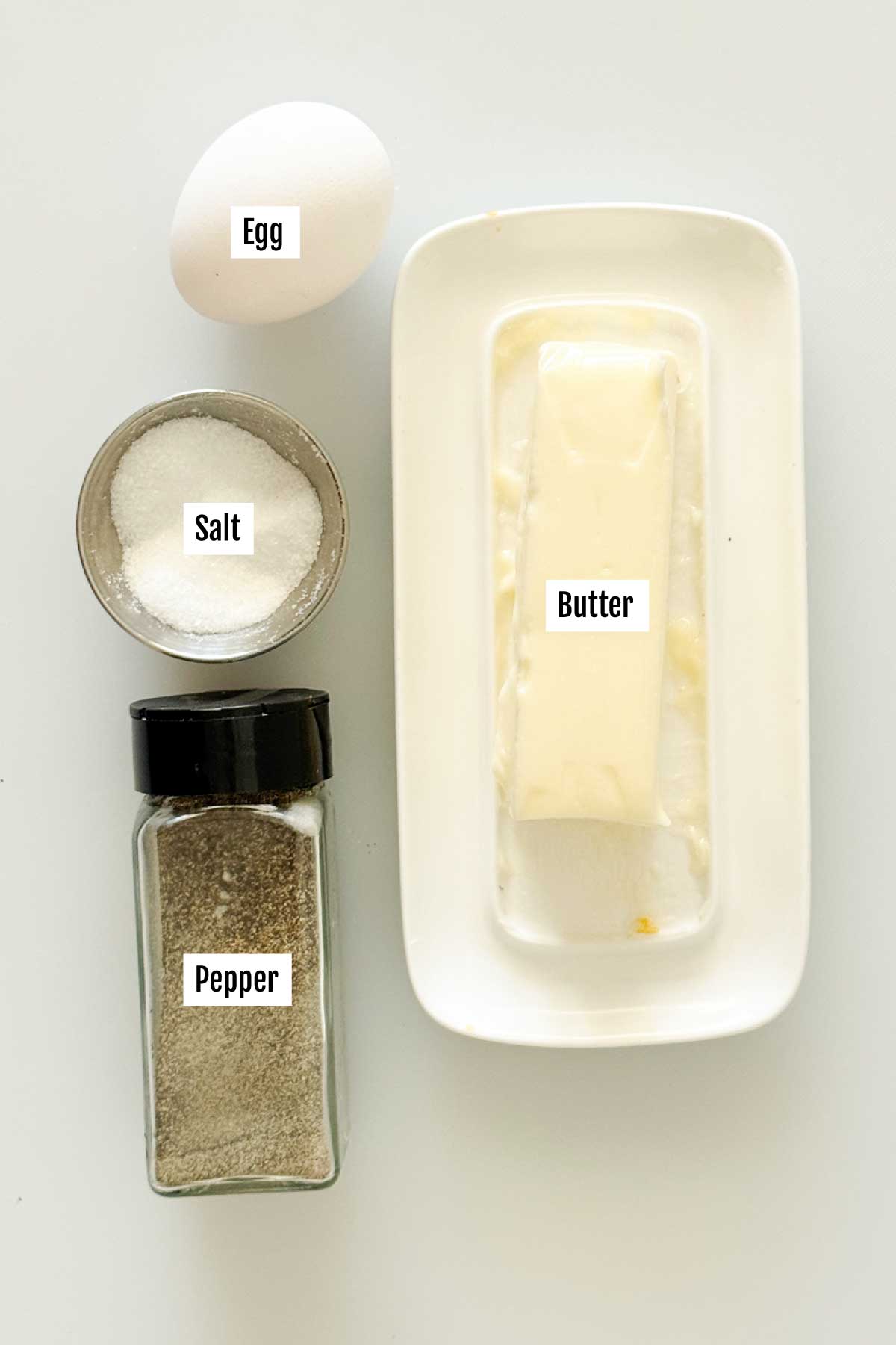 All the ingredients needed to make an egg folded omelet for breakfast sandwiches.