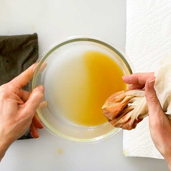 The excess liquid squeezed out of the pumpkin puree.