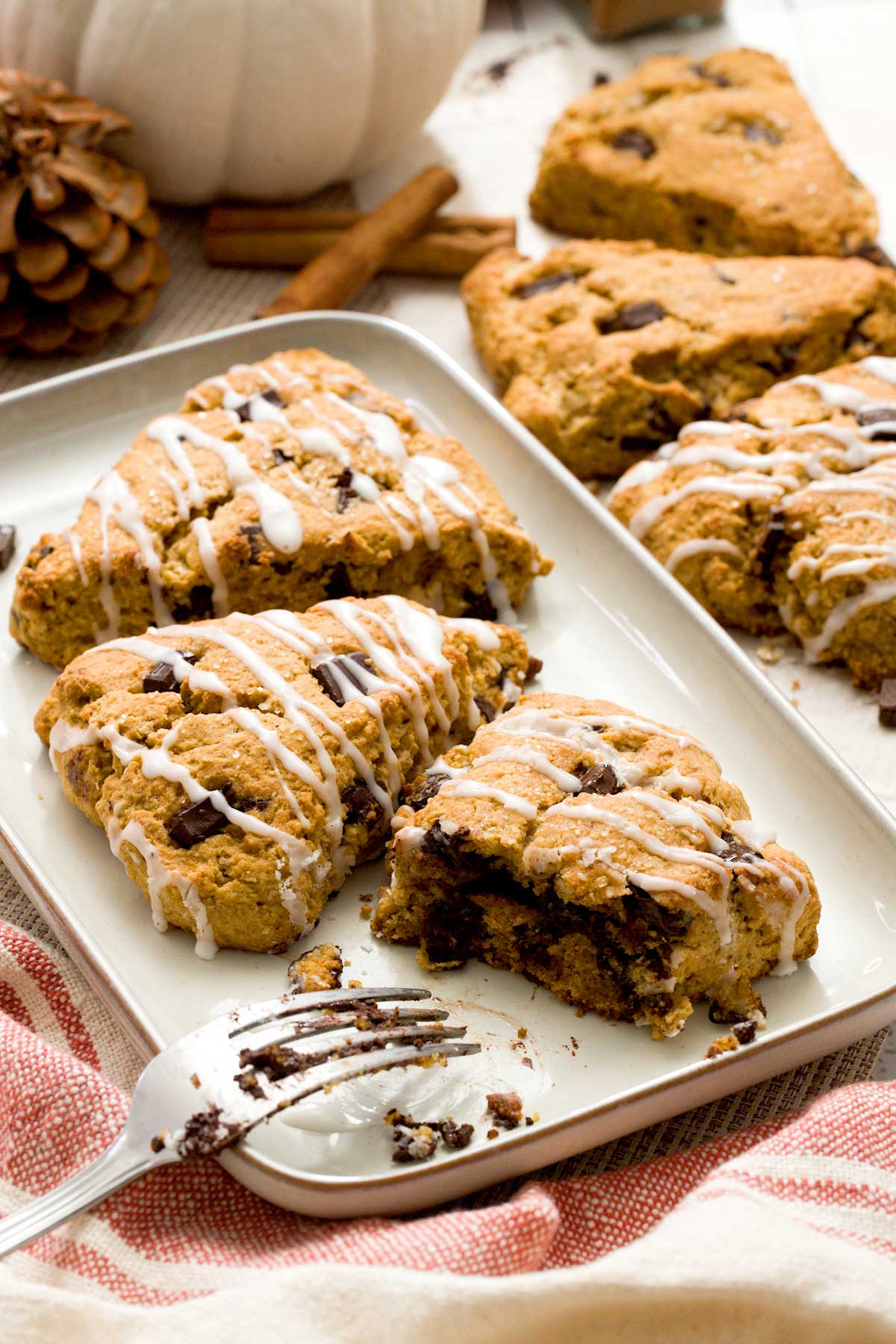 Three pumpkin cottage cheese scones on a plate.