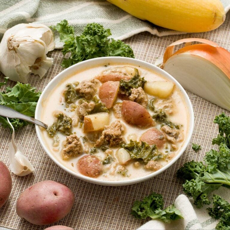 A bowl of healthy Zuppa Tuscana soup with ground turkey and greek yogurt with red potatoes.