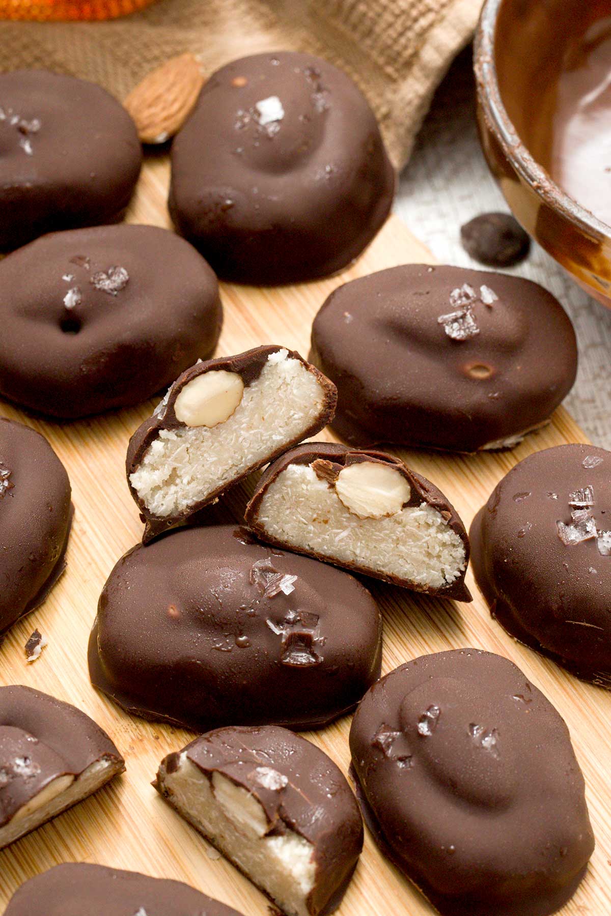 A close-up of dairy-free almond joy candy bars with sea salt on top.