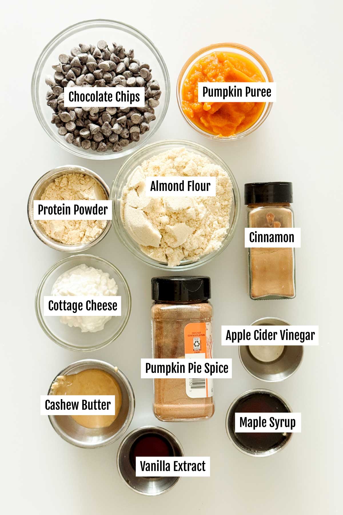 All the ingredients you need to make a batch of chocolate pumpkin truffles dipped in chocolate with swirls on top.