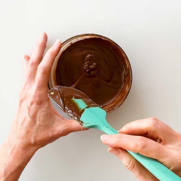 Stirring the melted chocolate.