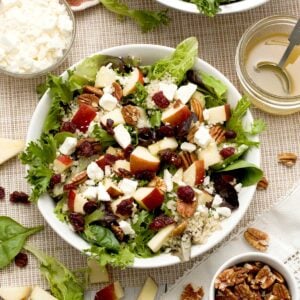 The top view of an apple quinoa cranberry salad with feta, pecans & tangy apple cider dressing.