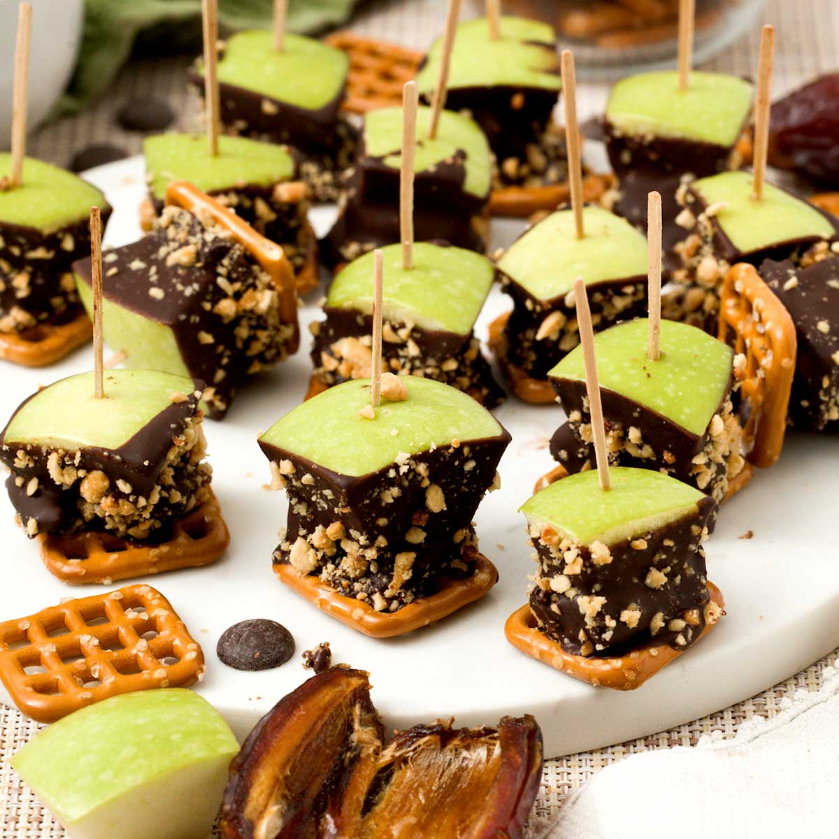 A batch of caramel apple pretzel bites with medjool dates and peanuts.